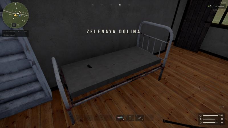 A bed in a house with a mattress and something lying on it