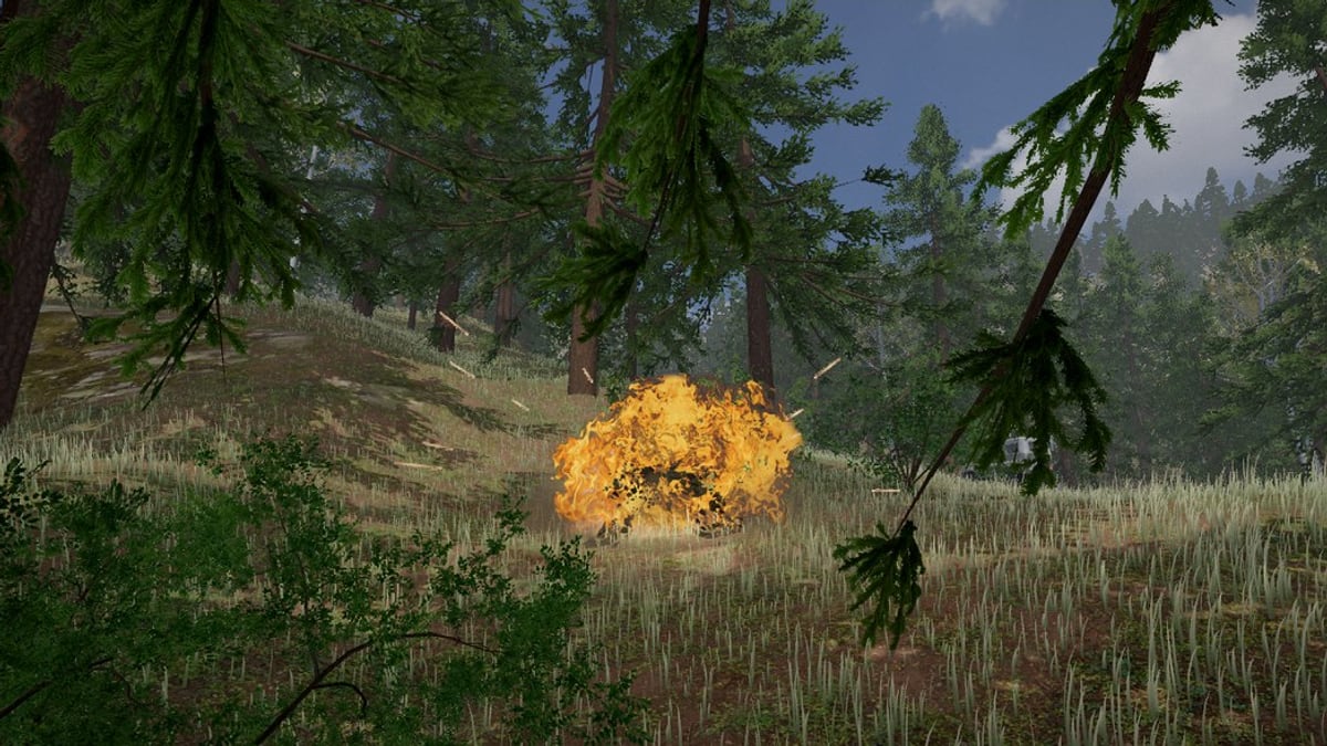 A grenade going off in long grass under pines: a low ball of orange fire on the ground, with sparks, and pine branches hanging in the foreground