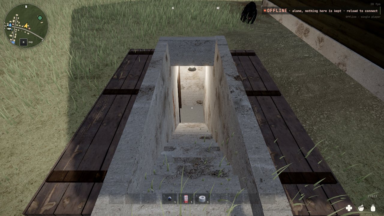 A storm cellar's opening in the grass of a barn yard, its two plank leaves thrown back either side of the kerb