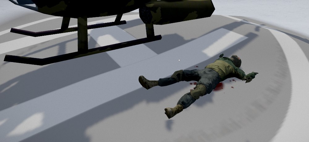 The same pilot lying on their back on the pad beside the helicopter's skids, blood on the ground under them
