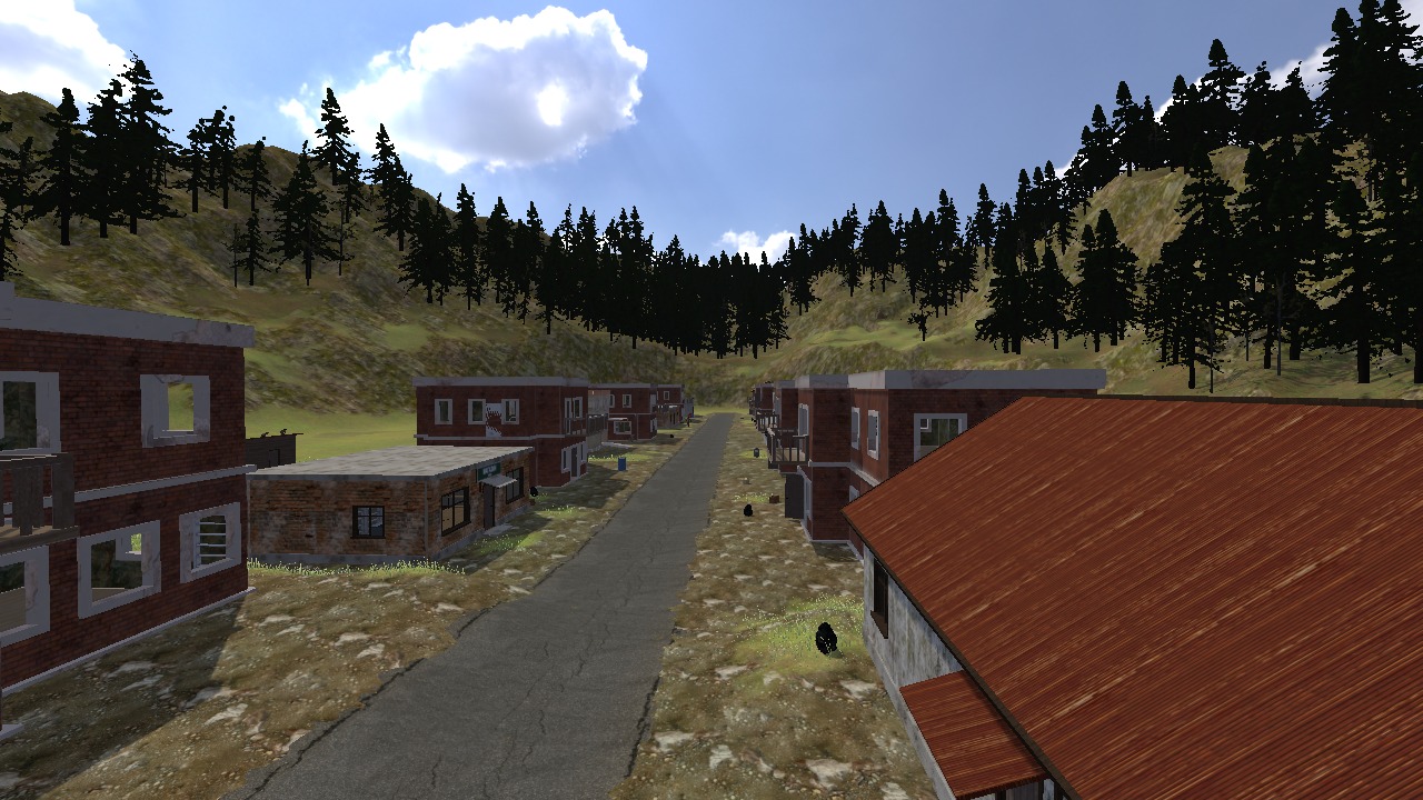 Kamenka's street between brick houses, wooded slopes behind