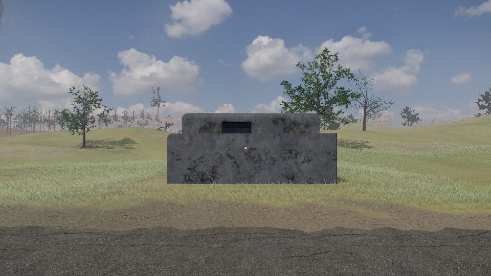 A grey concrete pillbox with a gun slit, standing in grass beside a road in the west, a low blast wall before its door