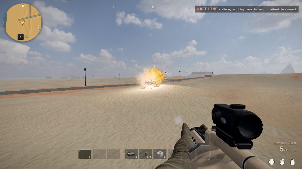 A 40 mm grenade from the M32 going off in the desert, a ball of fire on the sand