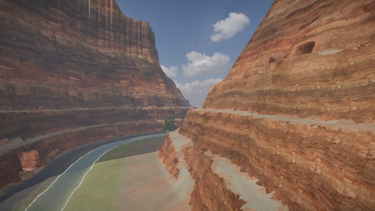 Looking along the canyon pass from a shelf high on its south wall: red walls banded in beds of rock, three shelves stepping up each side, the river and the road along the floor