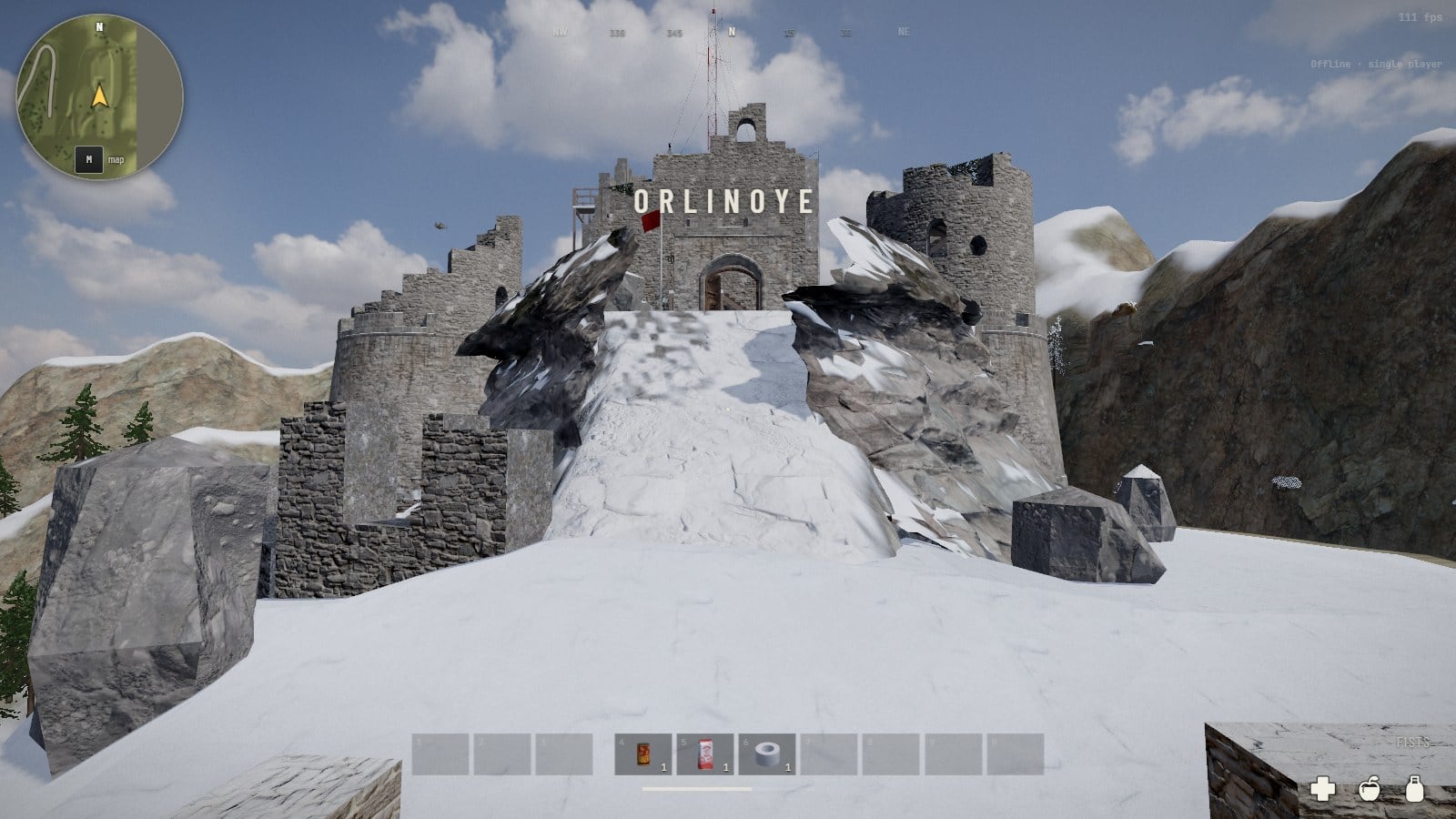 First person on a crest under snow: a way of trodden snow between big grey boulders runs up to a stone fort of round towers and a square keep with broken tops, a radio mast and a small red flag over it, and the name Orlinoye across the middle of the screen. Bare rock mountains and a few pines either side