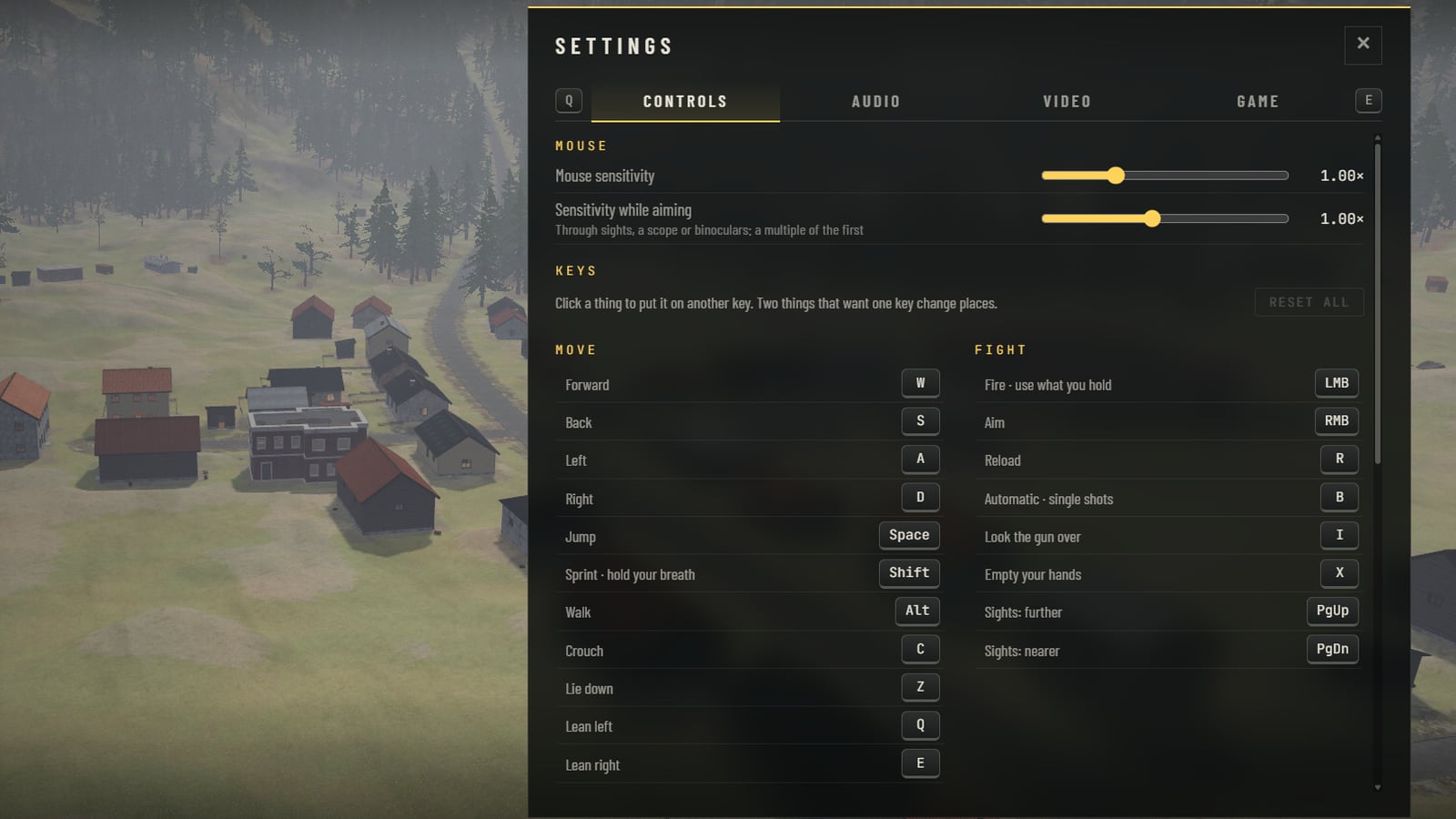 The Settings sheet of the menu, over a view of the village from the air: four tabs, Controls, Audio, Video and Game, with Controls open. A slider for mouse sensitivity and one for sensitivity while aiming, both at 1.00 times, and under them every key in two columns, Move and Fight